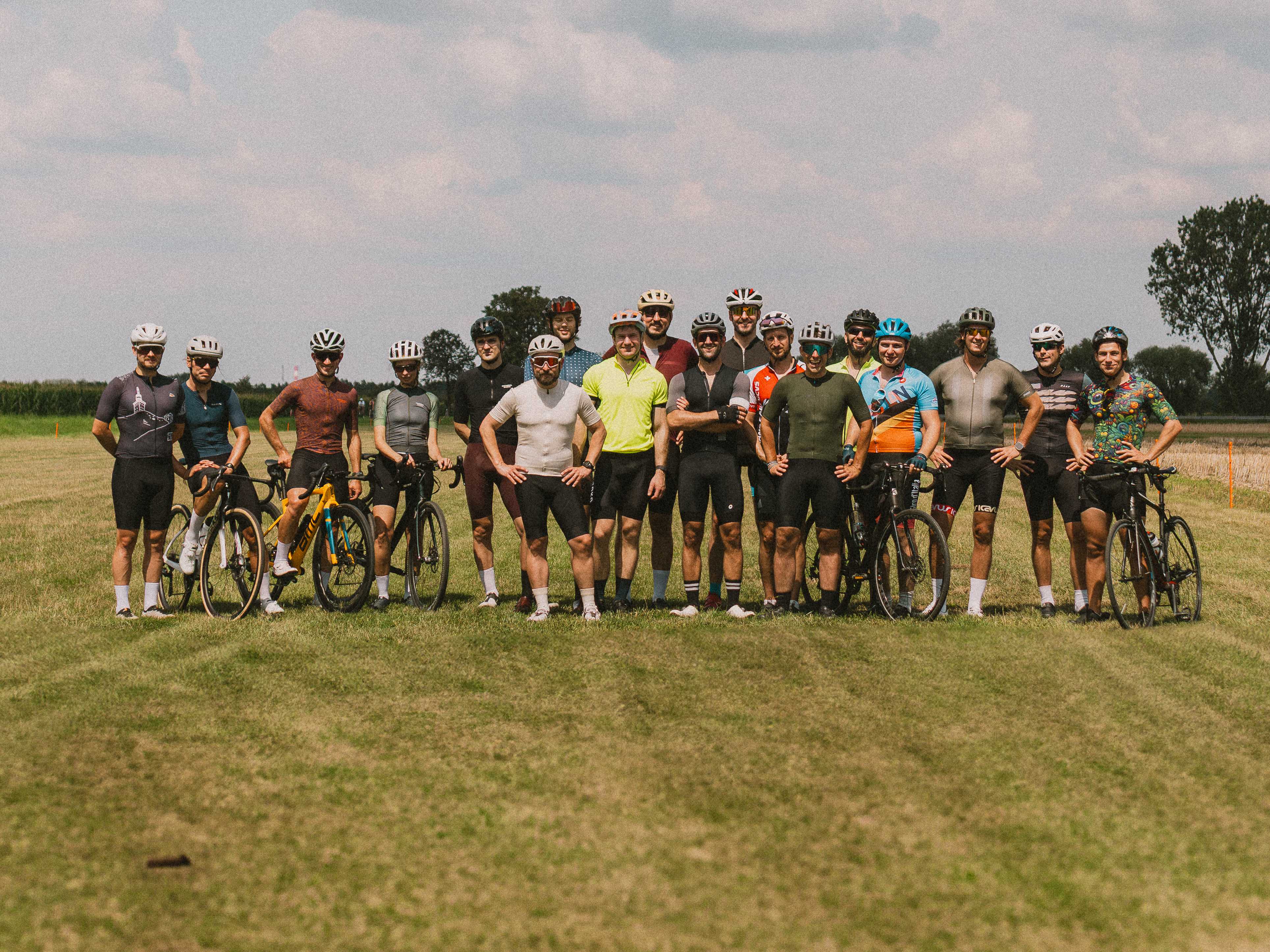 Founders Ride - group of cycling entrepreneurs on a green field